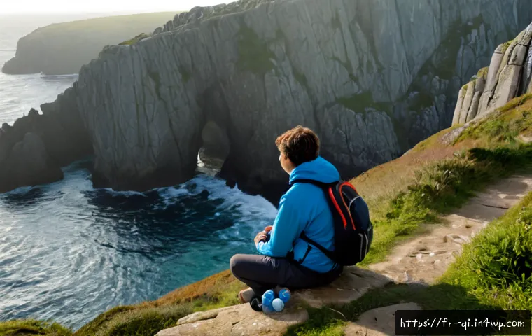 명상적 여행의 잠재적 위험 - Photorealistic French traveler sitting alone on a rocky coastal path in Brittany at early dawn, paus...